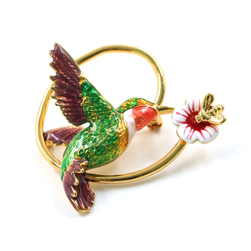 Broche d'oiseau et de fleur en laiton plaqué or