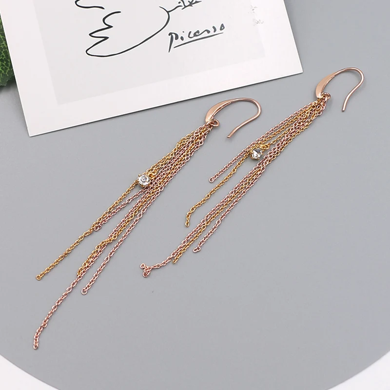 Chaînes de gland avec boucles d'oreilles en diamant